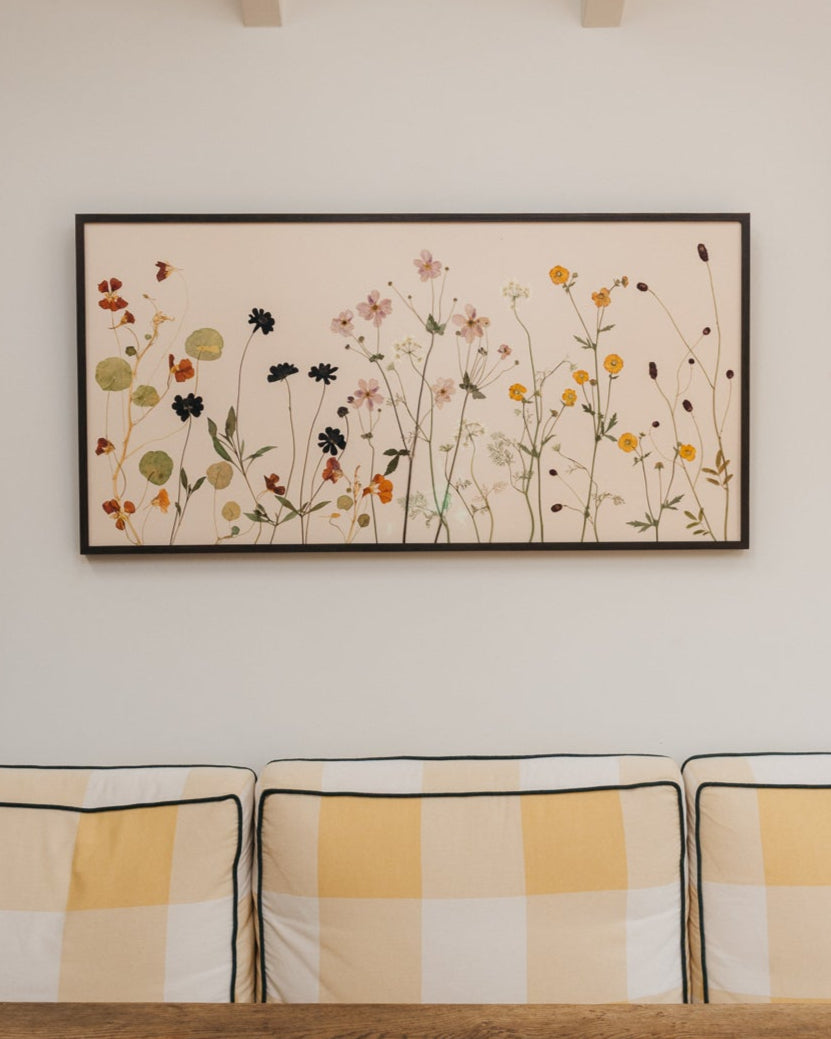 Framed pressed flower art - late summer flowers arranged in a natural composition as if growing in the garden - nasturtium, chocolate cosmos, japanese anemone, geum, orlaya and sanguisorba; landscape composition, framed in dark ebony stained wood.